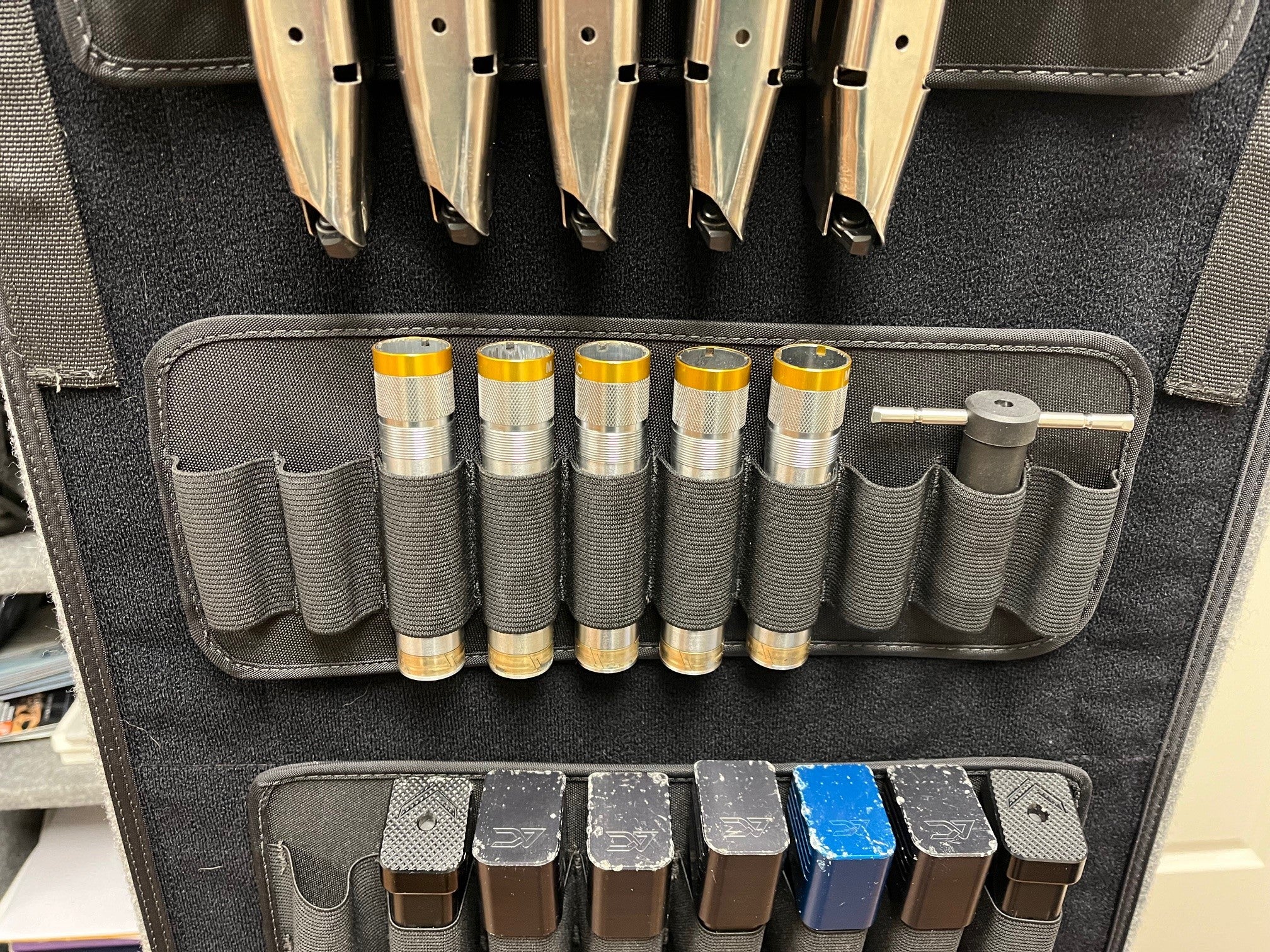 Shotgun panel displayed on gun safe door