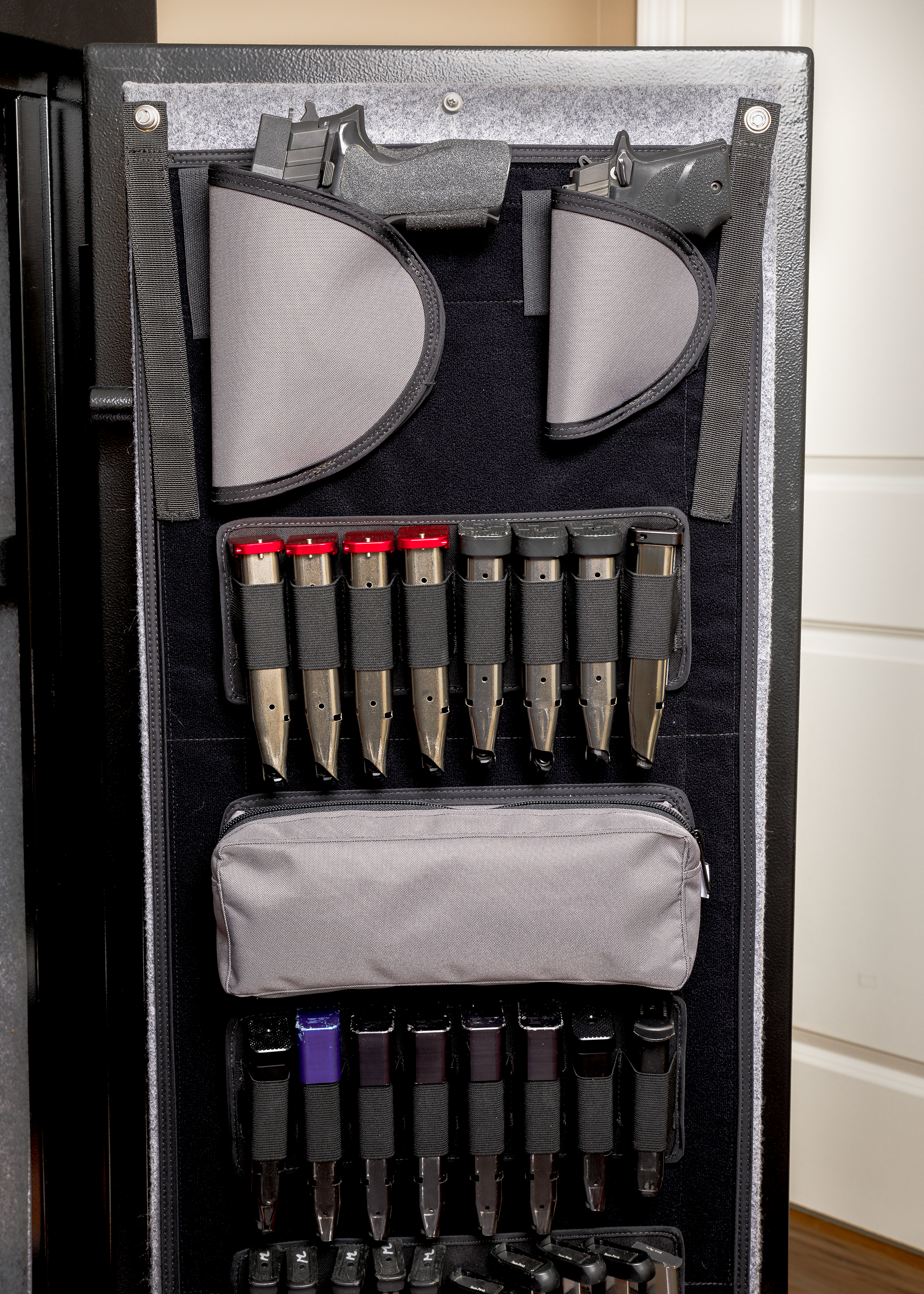 Gun safe panel organizer displaying pistol mounts, magazine panels and organizer pouch