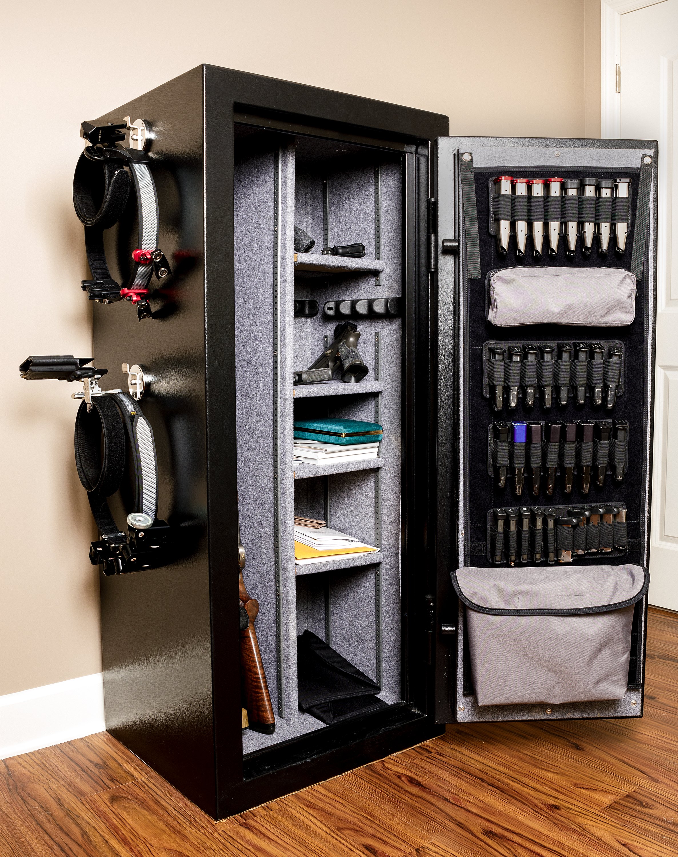 Wide shot of gun safe door panel organizer showing all shooting accessories neatly put away