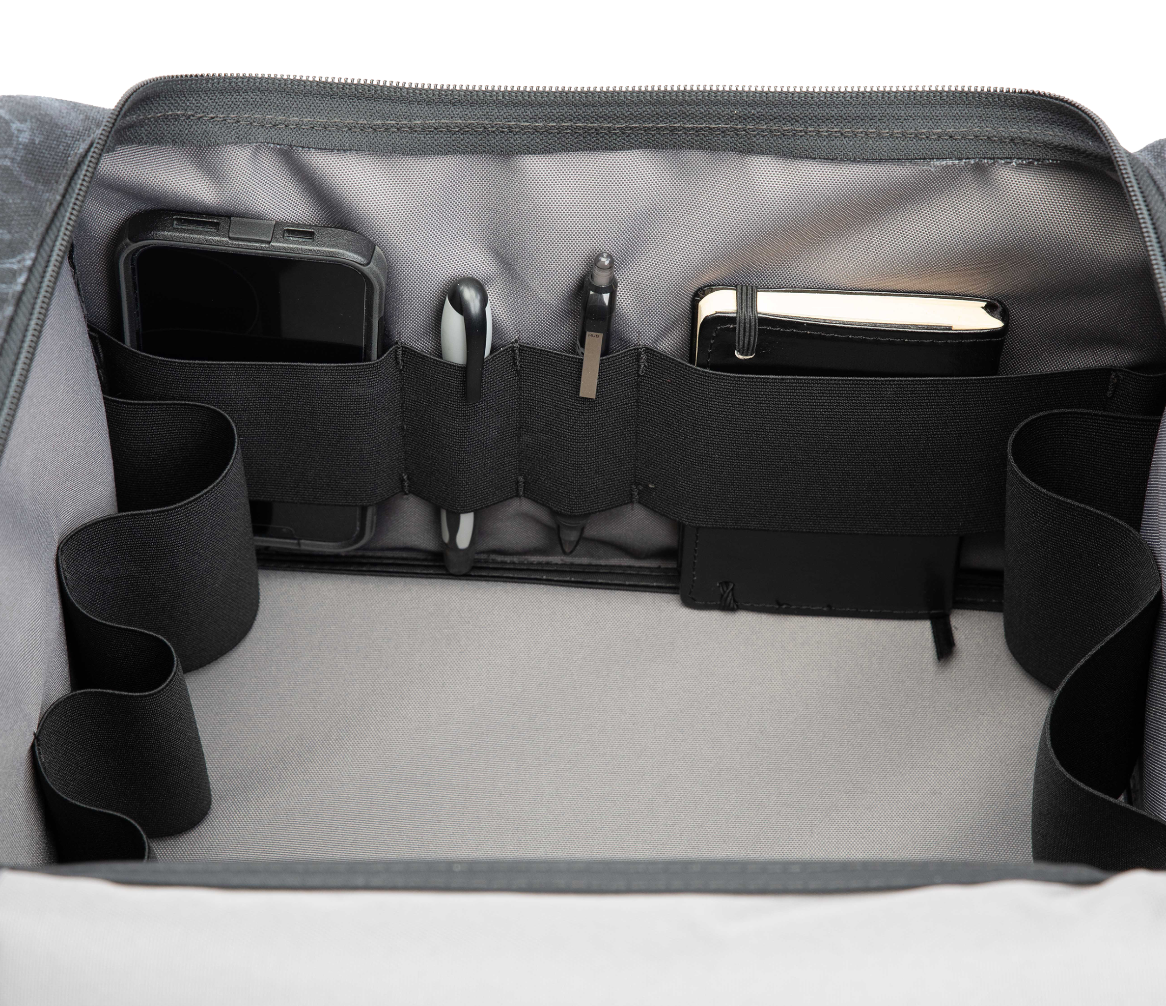 S3 Range Cart Rugged Caddy inside look at range bag with accessory straps holding phone, pens, and notepad